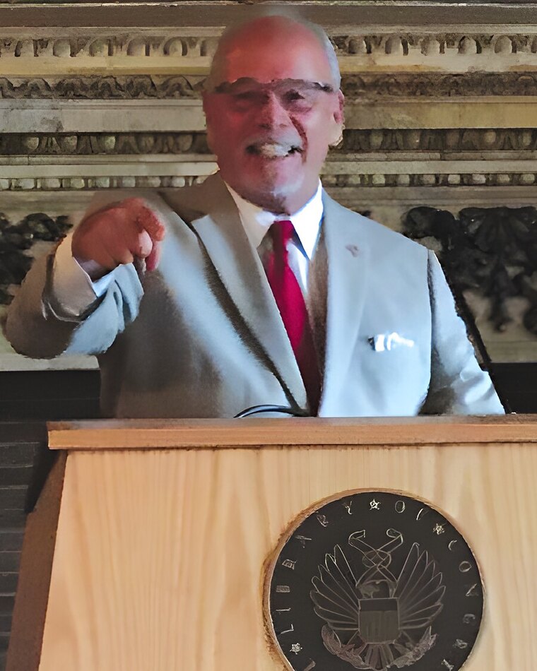 Paul Nix speaking at a podium